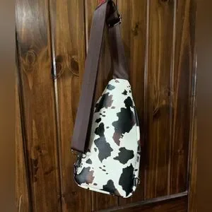 LNWOT Sam and Hadley Studded Cow Print Sling Backpack Faux Leather Brown White Sam & Hadley | Bags | Nwt Beautiful Cow Print Sling Bag  main image 2